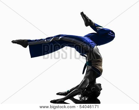 one caucasian woman capoiera dancer dancing in silhouette studio isolated on white background