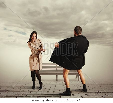 laughing woman take a picture exhibitionist in the street