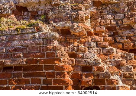 Fragment of old brick wall