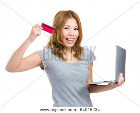 Woman using credit card for onling shopping