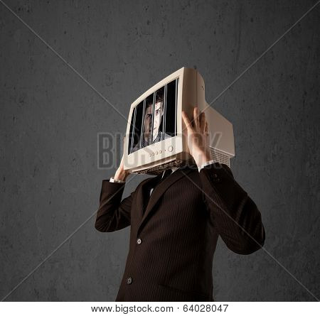 Business man with monitor screen on his head traped into a digital system concept