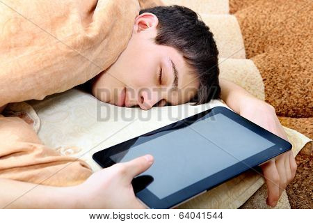 Teenager Sleeps With Tablet Computer