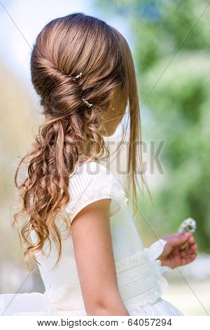 Detail Of Girl's Communion Hairstyle.