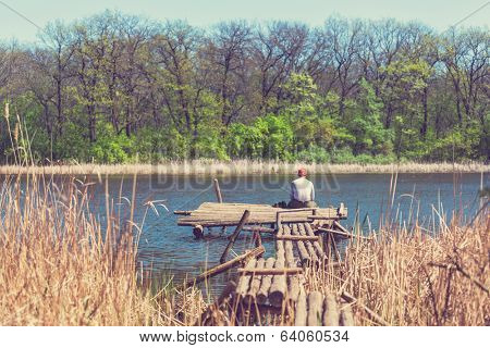 Man on summer lake