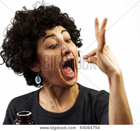 Woman swallows a pill