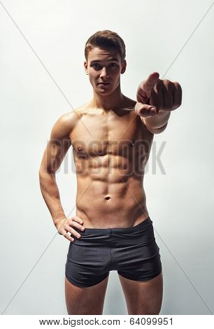 Muscular Man In Underwear Pointing Forward