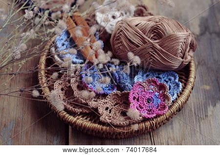 Box Of Yarn And Crocheted Flowers