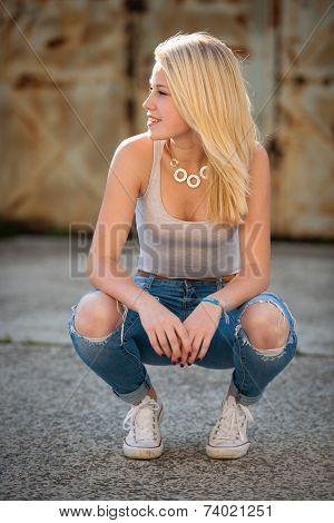 Young Blonde Caucasian Girl Alone On A Street