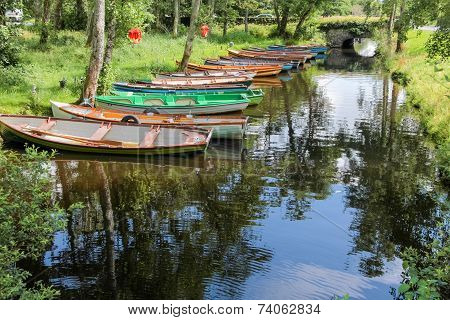 Rowing Boats On A Peaceful River