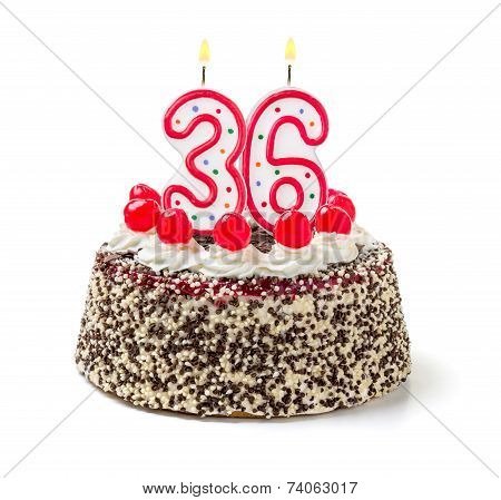 Birthday cake with burning candle number 36