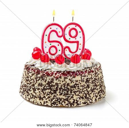 Birthday cake with burning candle number 69