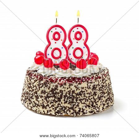 Birthday cake with burning candle number 88