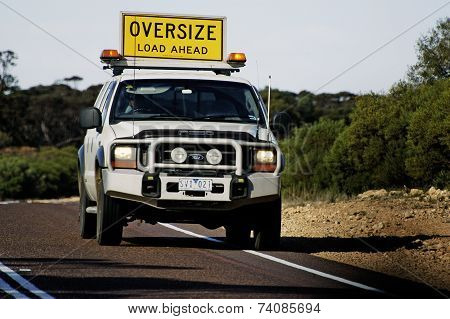 Pilot Car Before A Huge Australian Truck