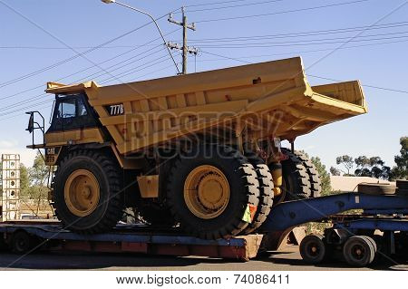 Transporting A Large Dumper Truck On A Road