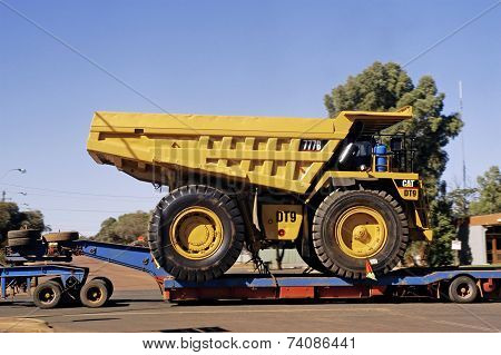 Transporting A Large Dumper Truck On A Road