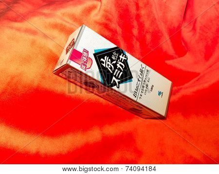 GOMEL, BELARUS - AUGUST 23, 2014:Japanese toothpaste Kobayashi with charcoal.Kobayashi Pharmaceutical Co., Ltd. manufactures and sells OTC pharmaceuticals, oral hygiene products.