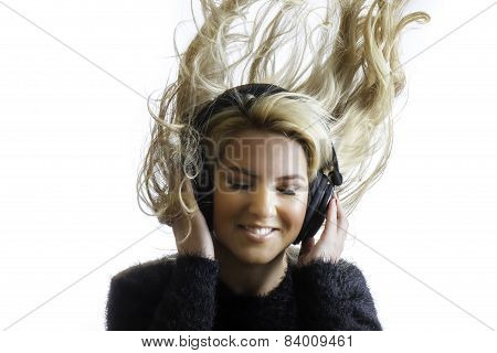 Pretty Girl Flinging Hair Listening Headphones Isolated Background