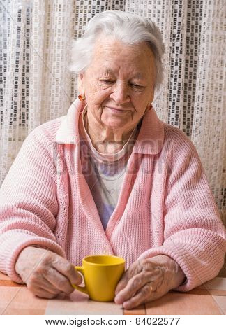 Portrait Of Old Woman With Cup Of Tea