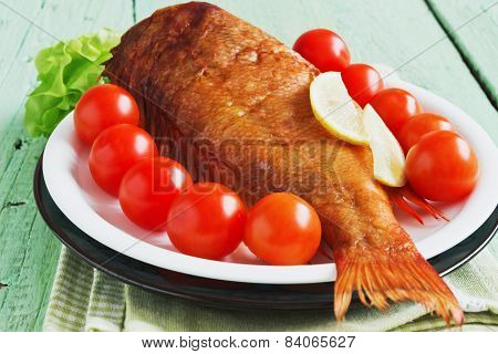 Smoked Sea Bass On Green Wooden Background