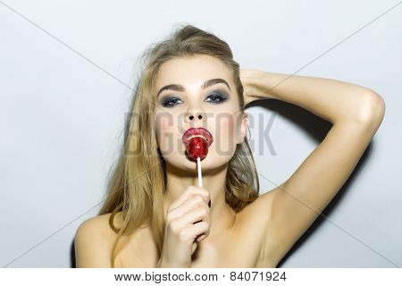 Young Sexy Girl With Lollipop Looking At The Camera