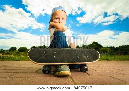 Skater Boy Child With His Skateboard. Outdoor Activity.