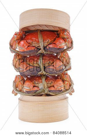 Hairy crabs on the Bamboo steamer Isolated in white background.
