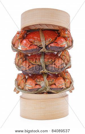 Hairy crabs on the Bamboo steamer Isolated in white background.