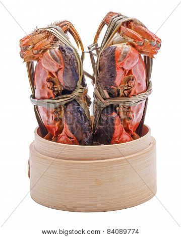 Hairy crabs on the Bamboo steamer Isolated in white background.