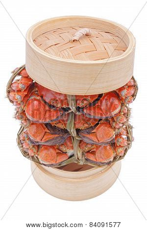 Hairy crabs on the Bamboo steamer Isolated in white background.