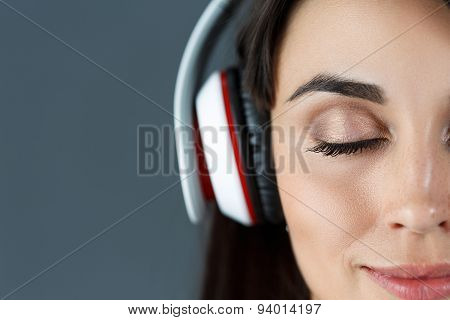 Beautiful Dark Haired Smiling Woman Wearing Headphones