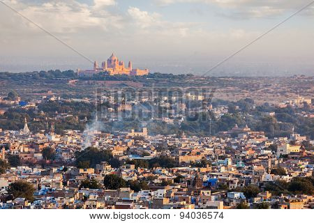 Aerial view of Jodhpur - the Blue city - with Umaid Bhawan Palace on sunset. View from Mehrangarh Fort.  Jodphur, Rajasthan, India