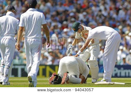 LONDON, ENGLAND - August 21 2013: Stuart Broad and Michael Clarke check on Shane Watson after he was hit on the head during day one of the 5th Ashes cricket match between England and Australia