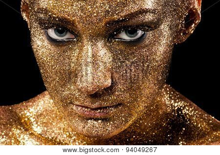 Gold makeup. Creative close-up portrait.