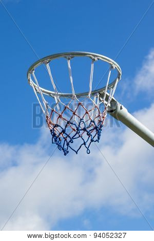 Netball hoop against blue sky