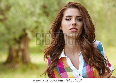 Beautiful woman under an olive tree