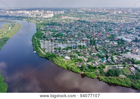 Disrict of private houses on bank of river. Tyumen