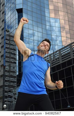 Attractive Sport Man Doing Victory And Winner Sign With His Arms After Running Training In Urban Bus