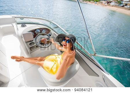 Woman driving yacht