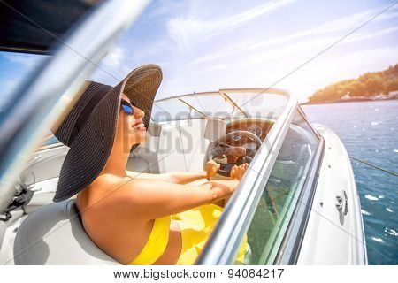 Woman driving yacht