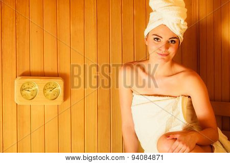 Woman Relaxing In Wooden Sauna Room