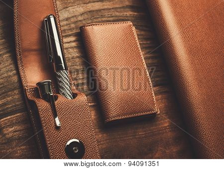 Luxurious rollerball pen on a wooden background 