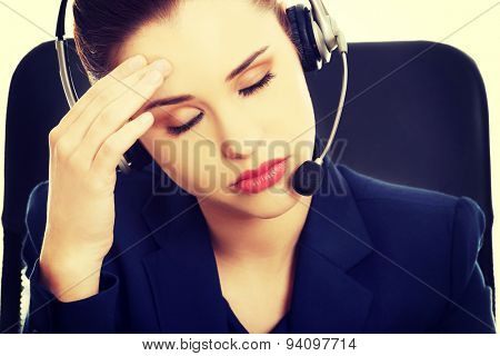 Portrait of anoyed support phone operator in headset