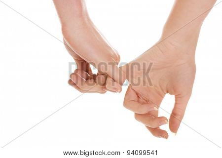 Woman's and man's hands together.