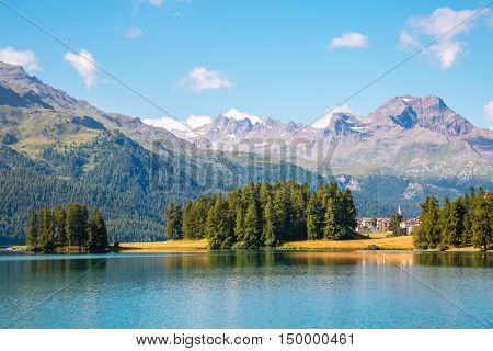 Great view of the azure pond Champfer in alpine valley. Popular tourist attraction. Picturesque and gorgeous scene. Location Swiss alps, Silvaplana village, district of Maloja, Europe. Beauty world.