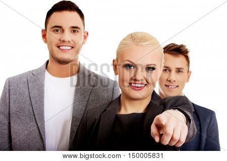 Business team-woman pointing at camera