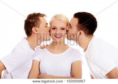 Two guys kissing friend woman cheeks