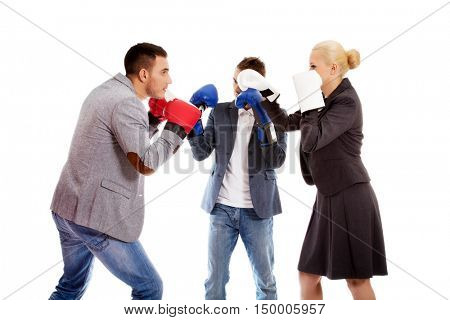 Three business people wearing boxing gloves start competition fight 