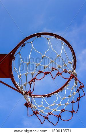 A view of a basketball hoop from below