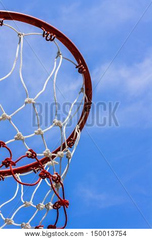 A view of a basketball hoop from below