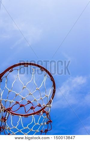 A view of a basketball hoop from below